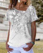 T-shirt scollo a V a fantasia floreale