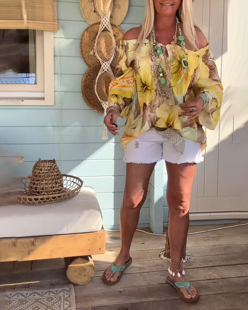 Blusa con scollo Bardot e stampa a tema resort