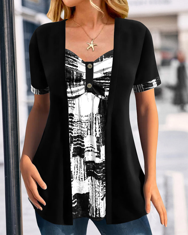 Blusa stampata finto due pezzi asimmetrica