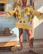 Blusa con scollo Bardot e stampa a tema resort