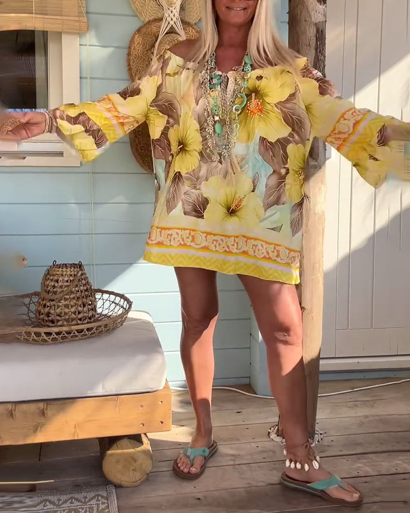 Blusa con scollo Bardot e stampa a tema resort