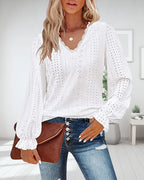 Top in pizzo a maniche lunghe con scollo a V