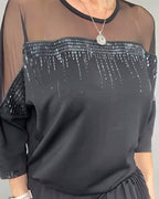 Blusa in maglia a trama larga e vestibilità ampia