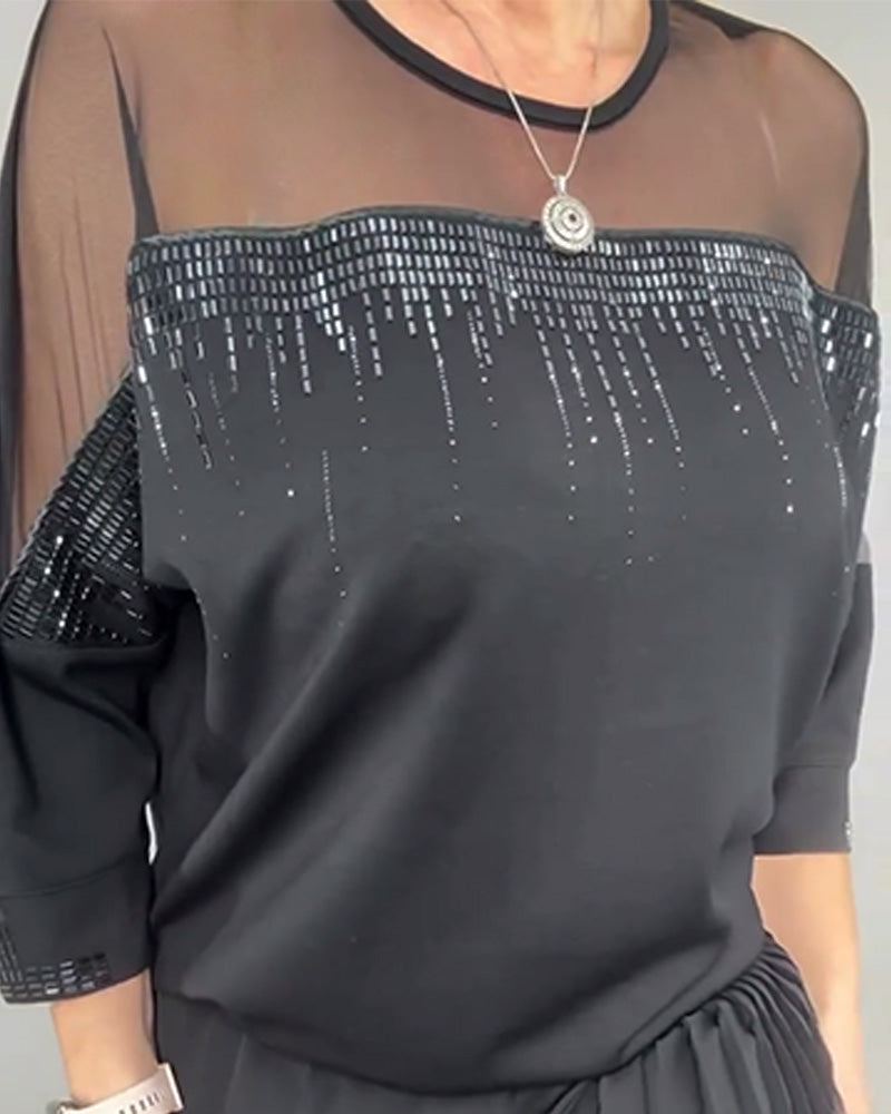 Blusa in maglia a trama larga e vestibilità ampia