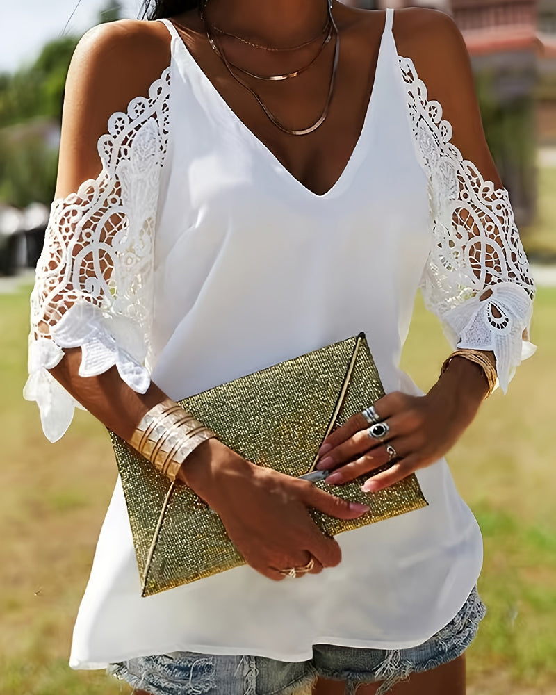 Blusa con spalle scoperte e trafori tinta unita