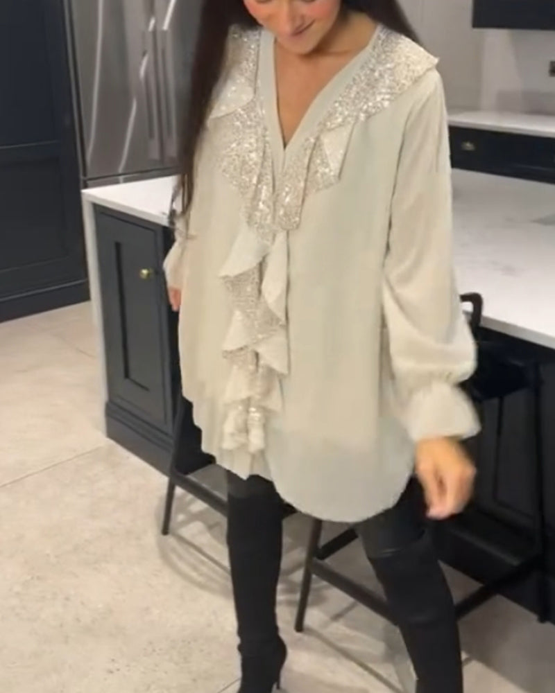 Camicetta con volant e stile elegante