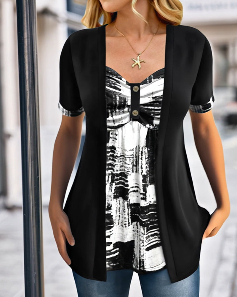Blusa stampata finto due pezzi asimmetrica