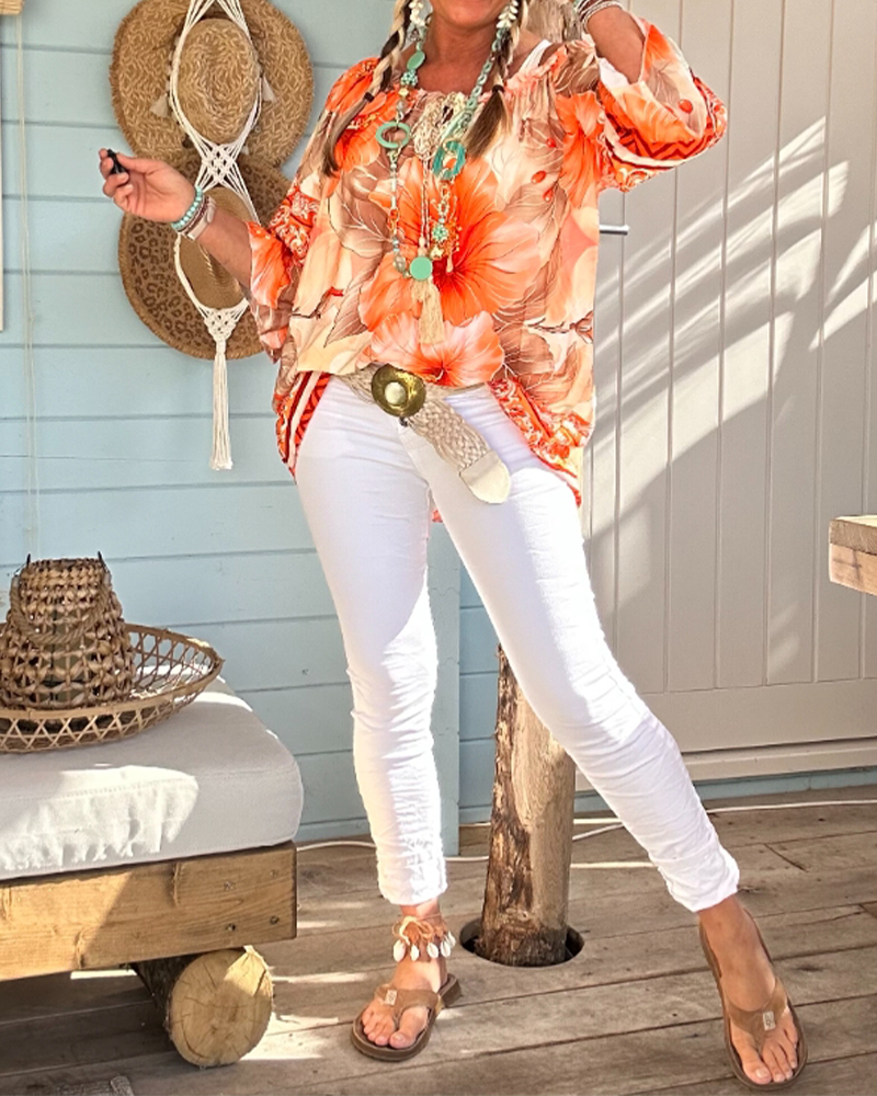 Blusa con scollo Bardot e stampa a tema resort