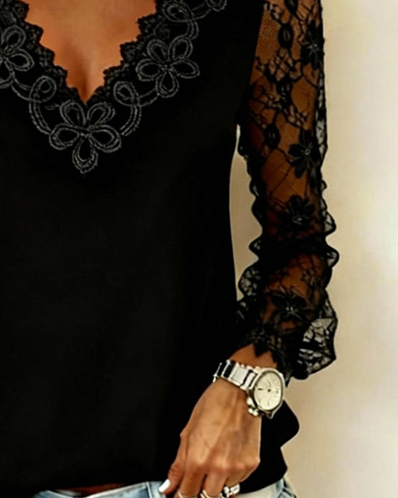 Top elegante a maniche lunghe con scollo a V