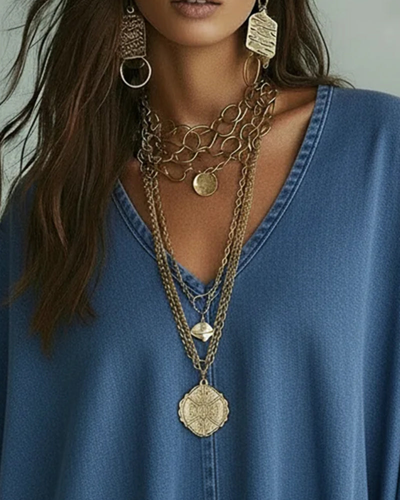 Camicetta in denim ampia con scollo a V irregolare