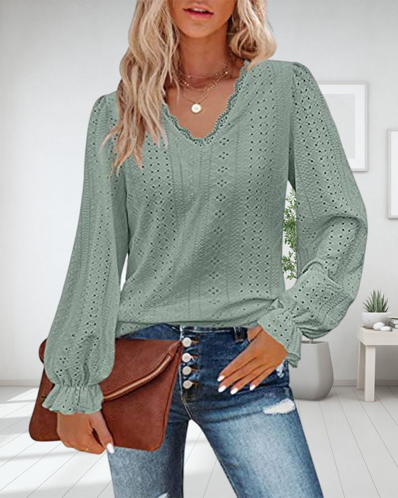 Top in pizzo a maniche lunghe con scollo a V