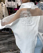 Camicetta floreale patchwork con risvolti in pizzo