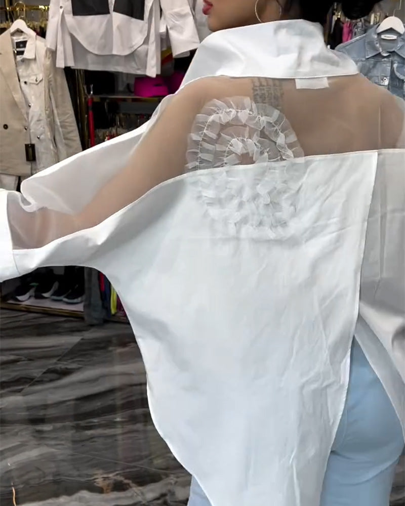 Camicetta floreale patchwork con risvolti in pizzo