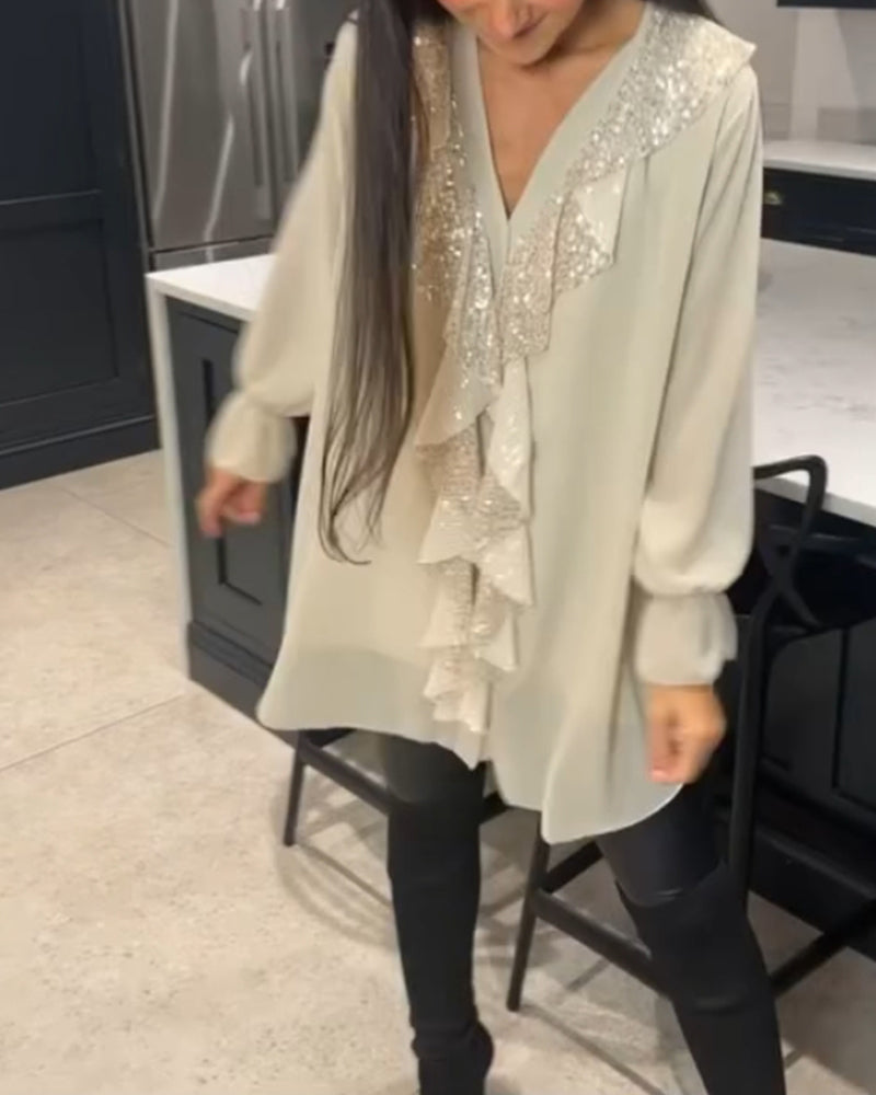 Camicetta con volant e stile elegante