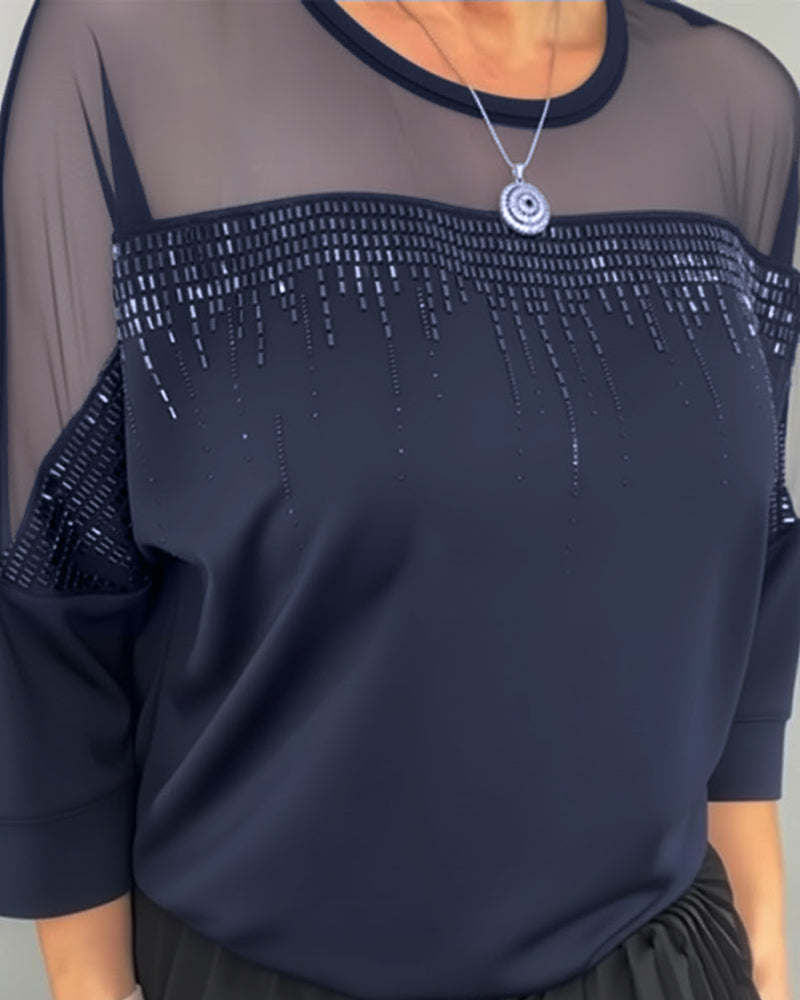 Blusa in maglia a trama larga e vestibilità ampia