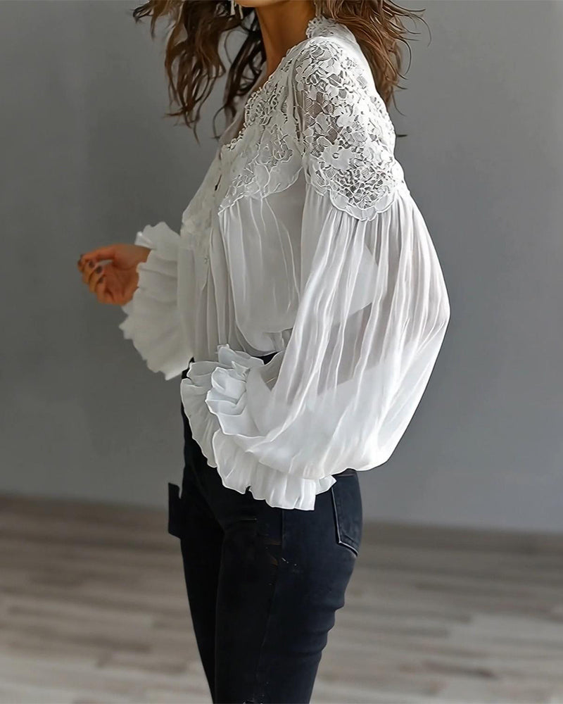 Camicetta in pizzo patchwork con scollo a V