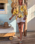Blusa con scollo Bardot e stampa a tema resort