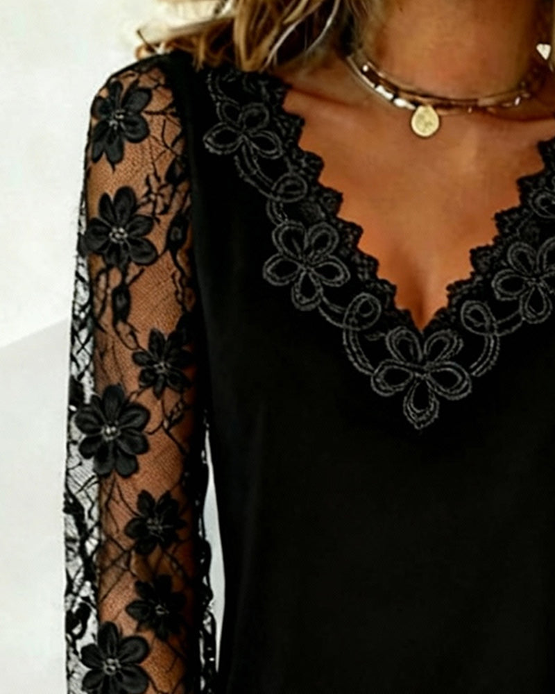 Top elegante a maniche lunghe con scollo a V