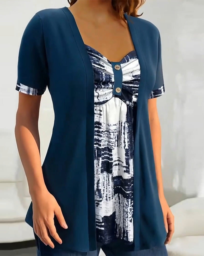 Blusa stampata finto due pezzi asimmetrica