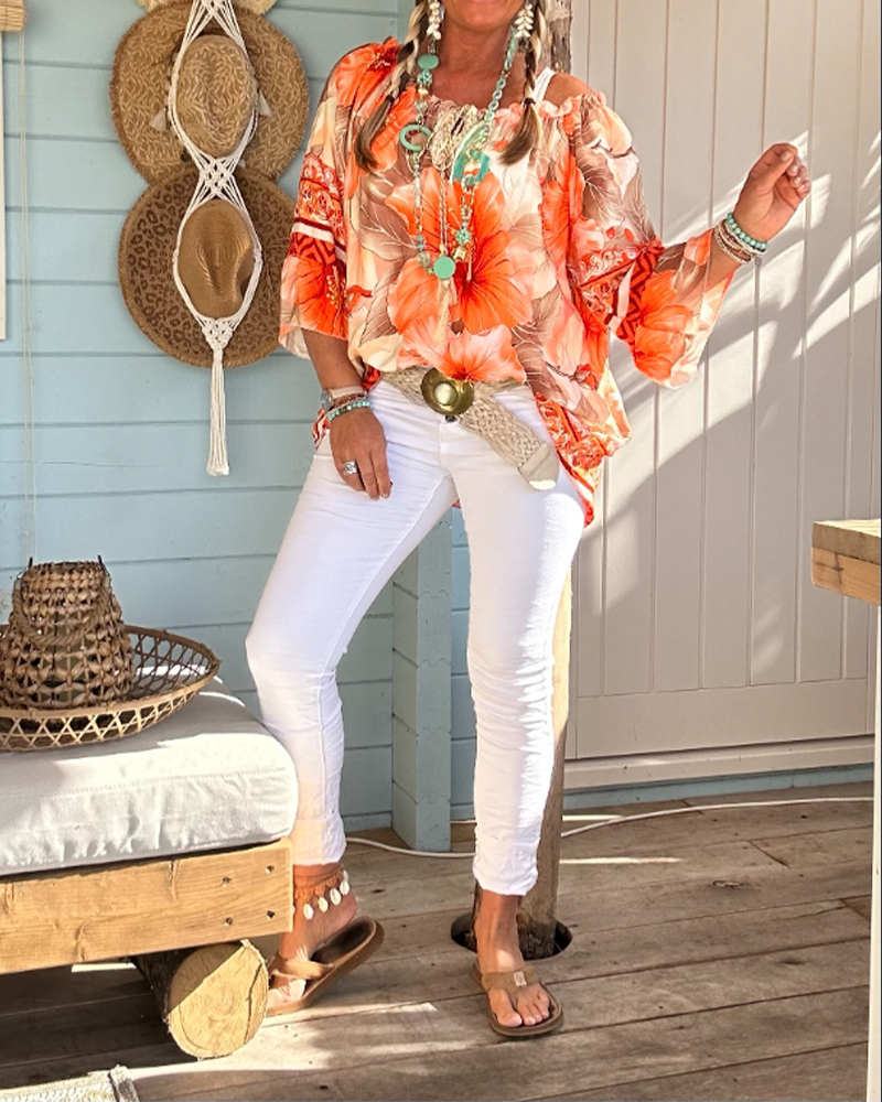 Blusa con scollo Bardot e stampa a tema resort
