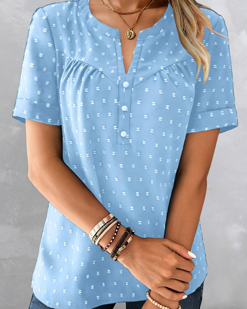Camicetta jacquard con scollo a V, mezza abbottonatura e maniche corte