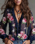 Blusa con volant al fondo e cerniera corta, stampa floreale