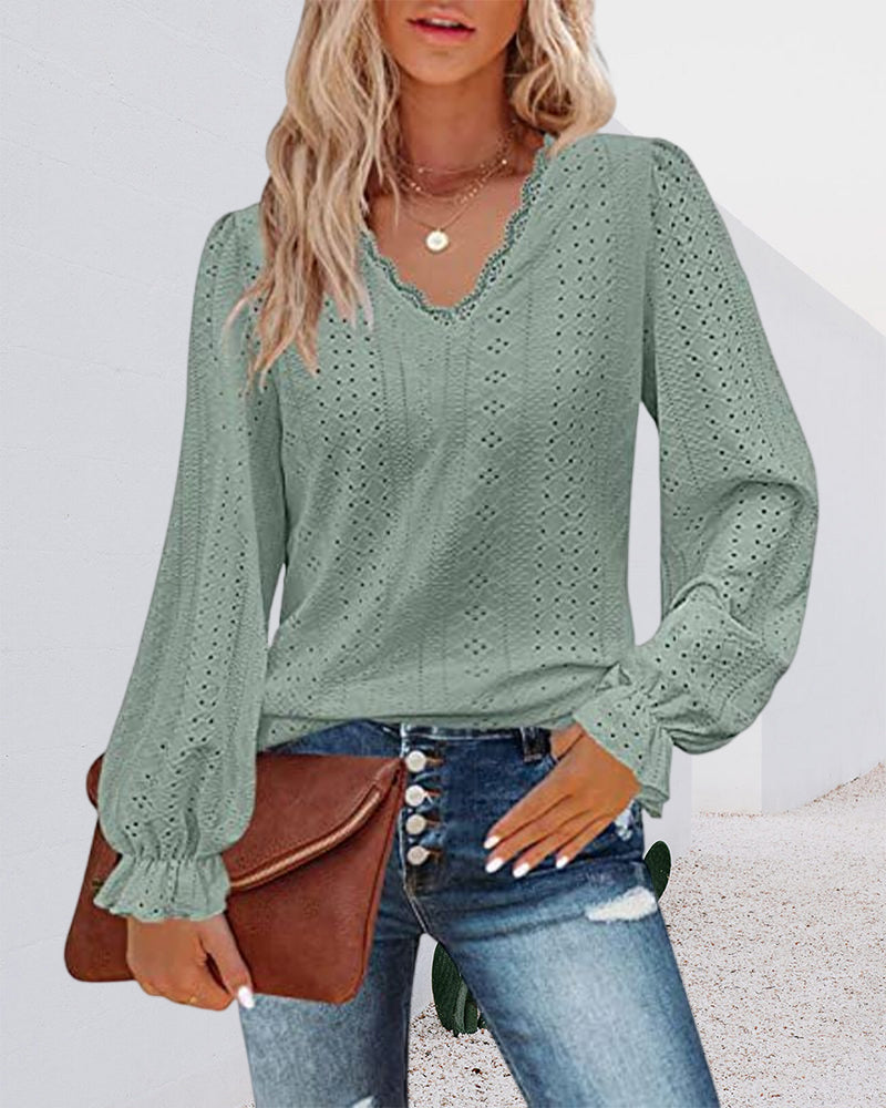 Top in pizzo a maniche lunghe con scollo a V