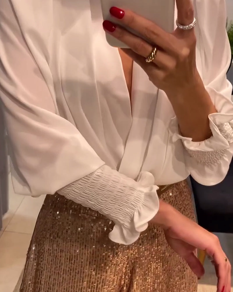 Camicetta elegante a tinta unita con scollo a V e maniche a lanterna
