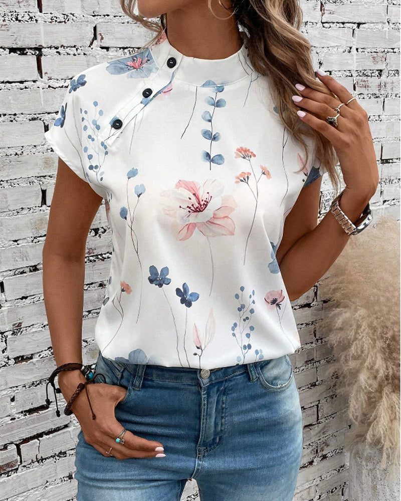 Top a maniche corte e collo alto con stampa floreale