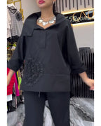 Camicetta floreale patchwork con risvolti in pizzo