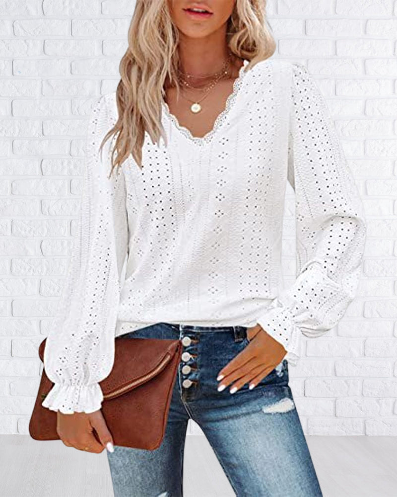 Top in pizzo a maniche lunghe con scollo a V