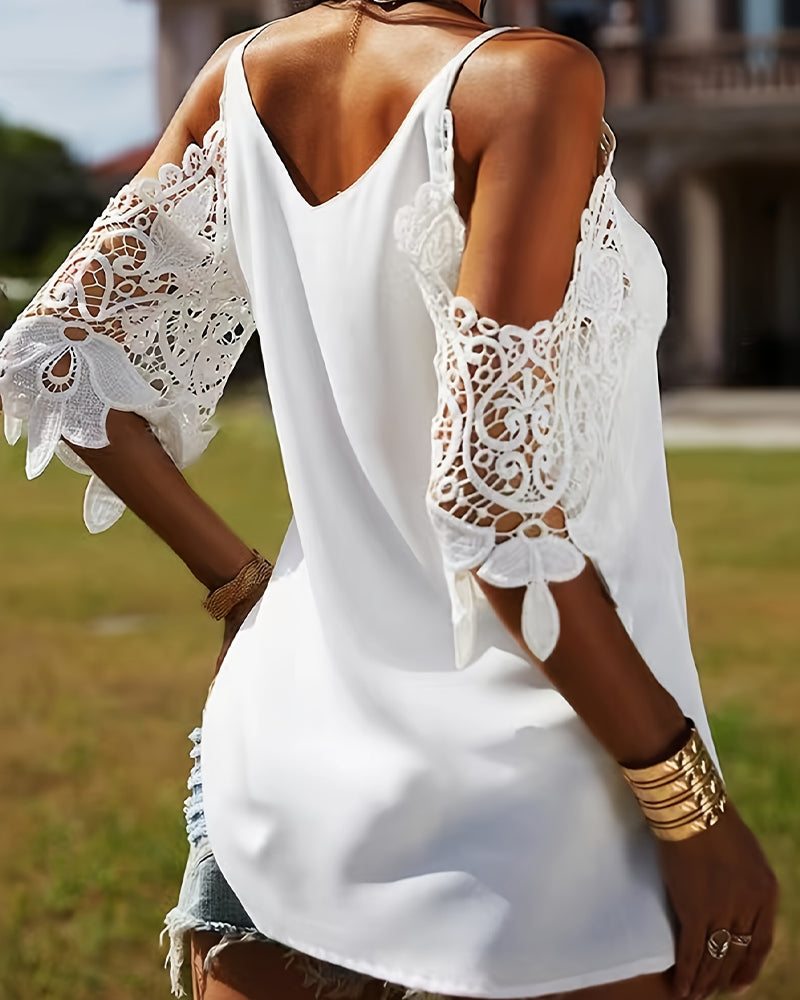 Blusa con spalle scoperte e trafori tinta unita