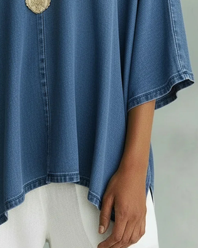 Camicetta in denim ampia con scollo a V irregolare