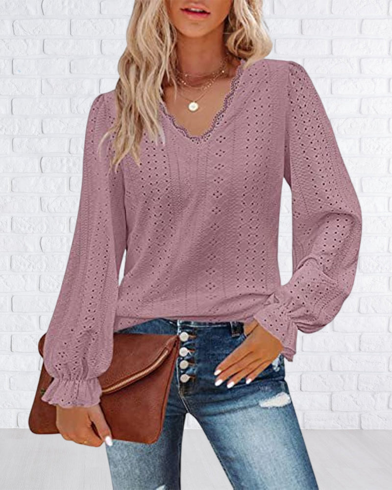 Top in pizzo a maniche lunghe con scollo a V