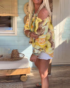 Blusa con scollo Bardot e stampa a tema resort