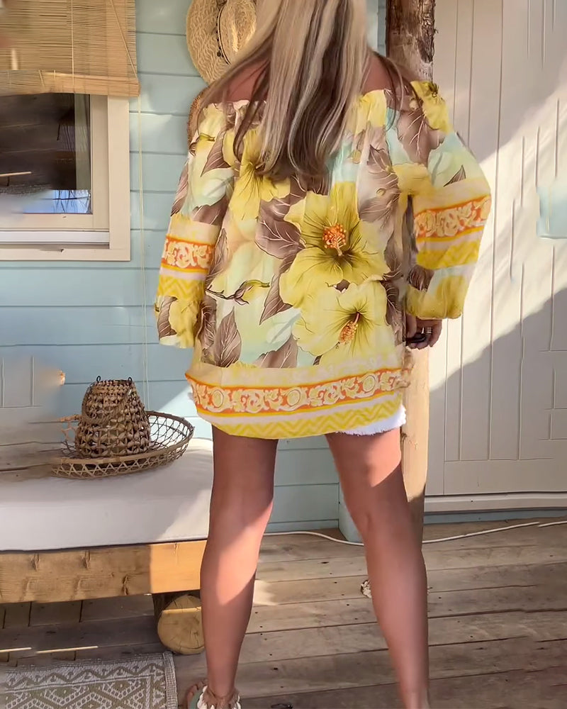 Blusa con scollo Bardot e stampa a tema resort