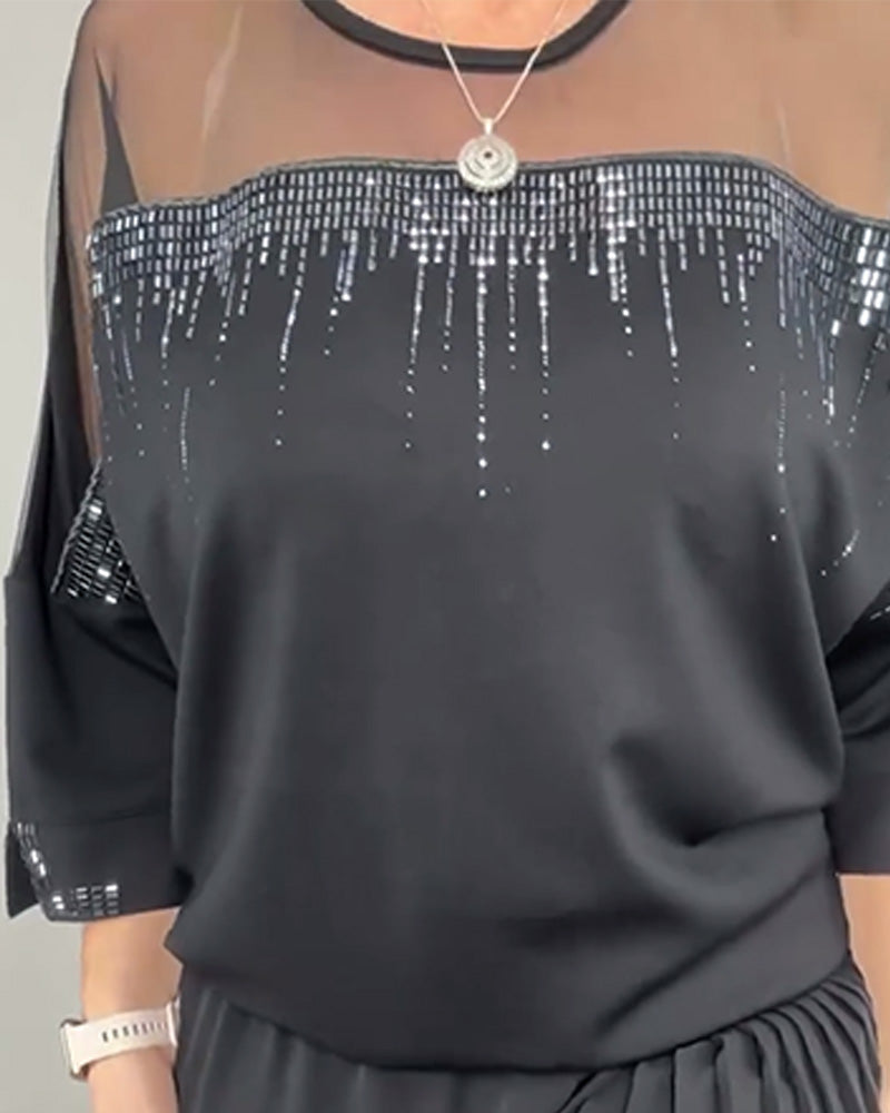 Blusa in maglia a trama larga e vestibilità ampia