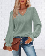 Top in pizzo a maniche lunghe con scollo a V