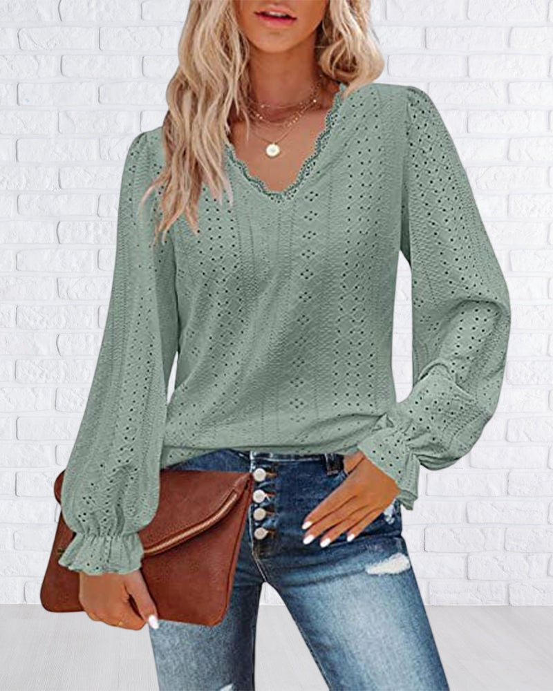 Top in pizzo a maniche lunghe con scollo a V