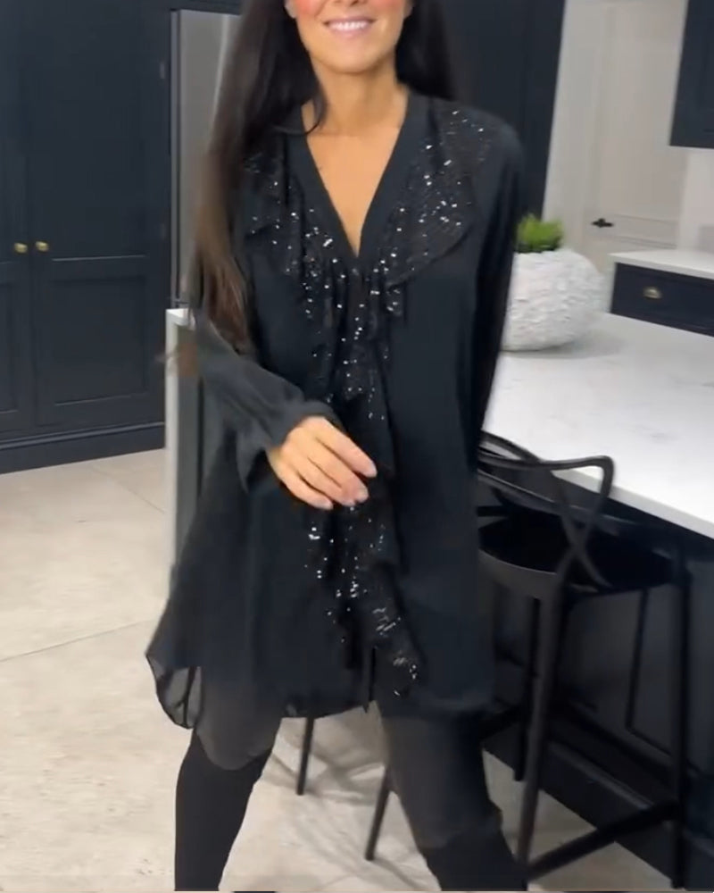 Camicetta con volant e stile elegante