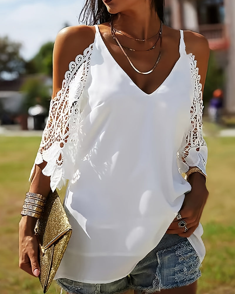 Blusa con spalle scoperte e trafori tinta unita