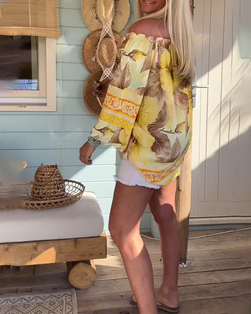 Blusa con scollo Bardot e stampa a tema resort