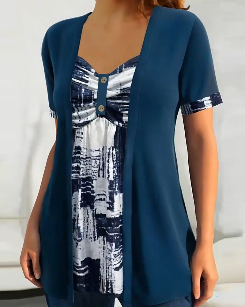 Blusa stampata finto due pezzi asimmetrica