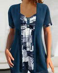 Blusa stampata finto due pezzi asimmetrica