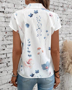 Top a maniche corte e collo alto con stampa floreale